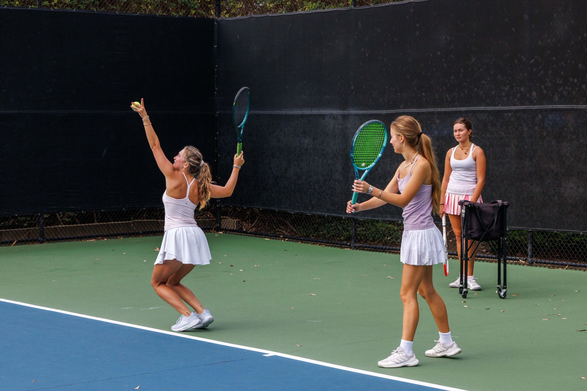 Junior tennis players practicing with DB Tennis coach