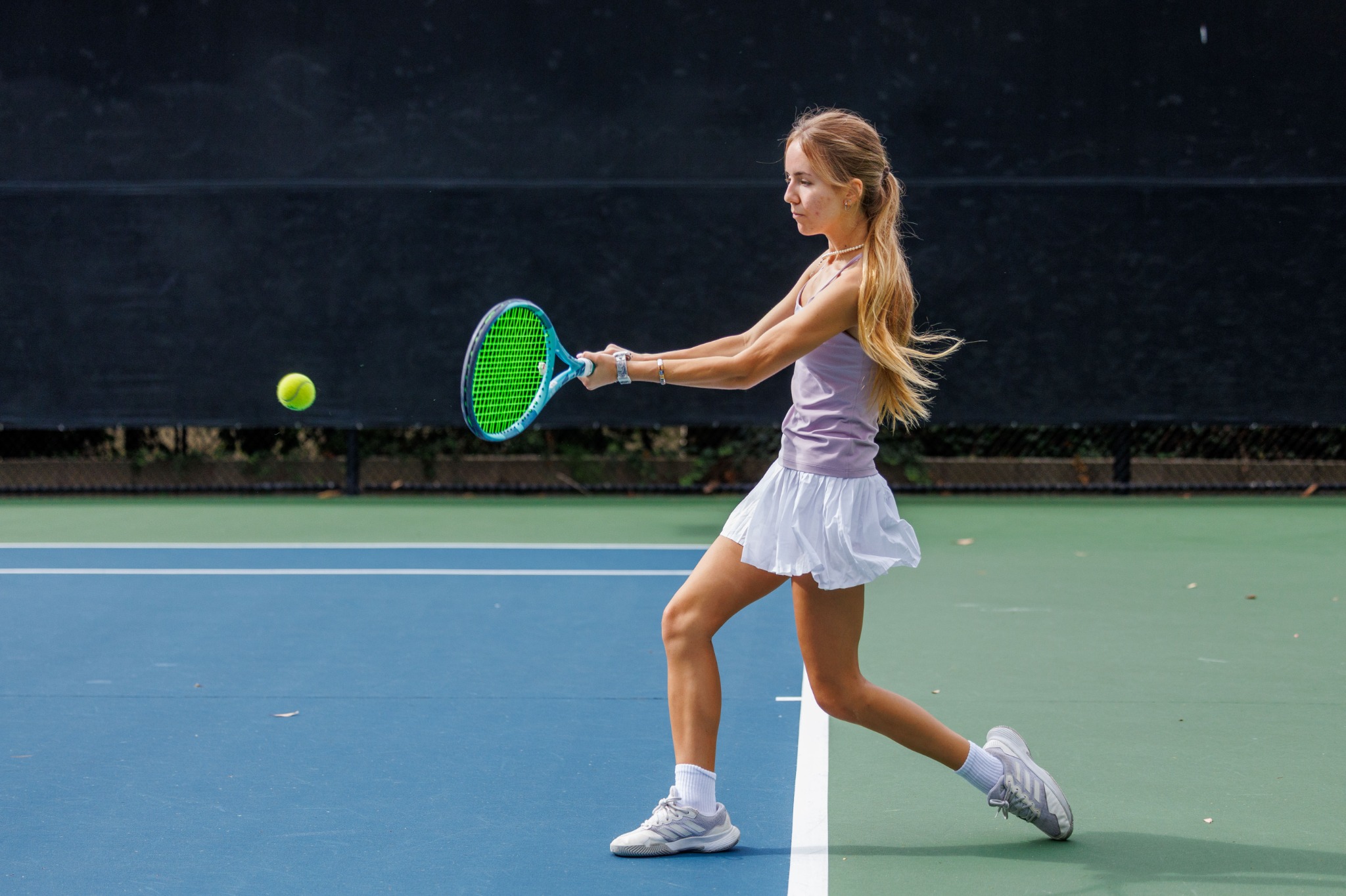 Junior tennis player on court